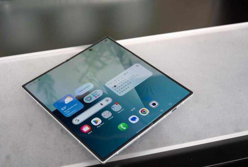 Samsung Galaxy Z Fold 7 unfolded showing its large foldable display and home screen interface.